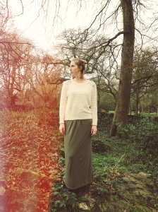 Becoming one with nature clad in a Penney's bejeweled sweater, and green maxi skirt.